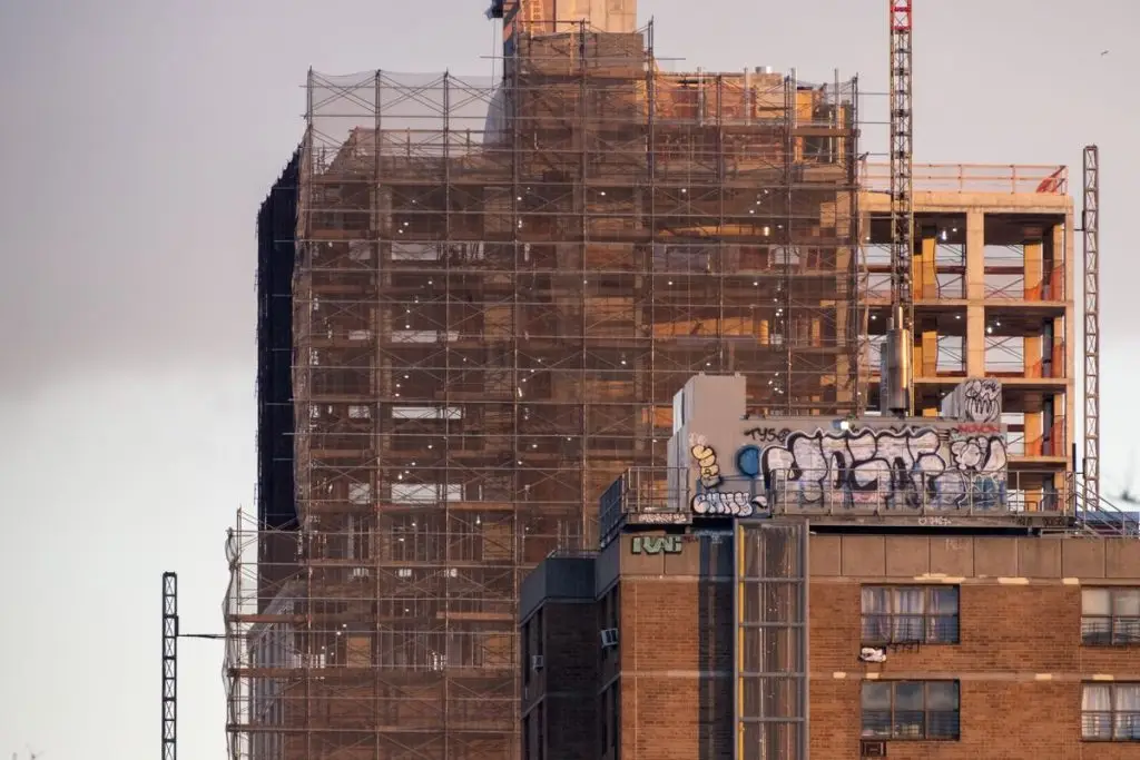 High-rise building under construction with scaffolding in New York